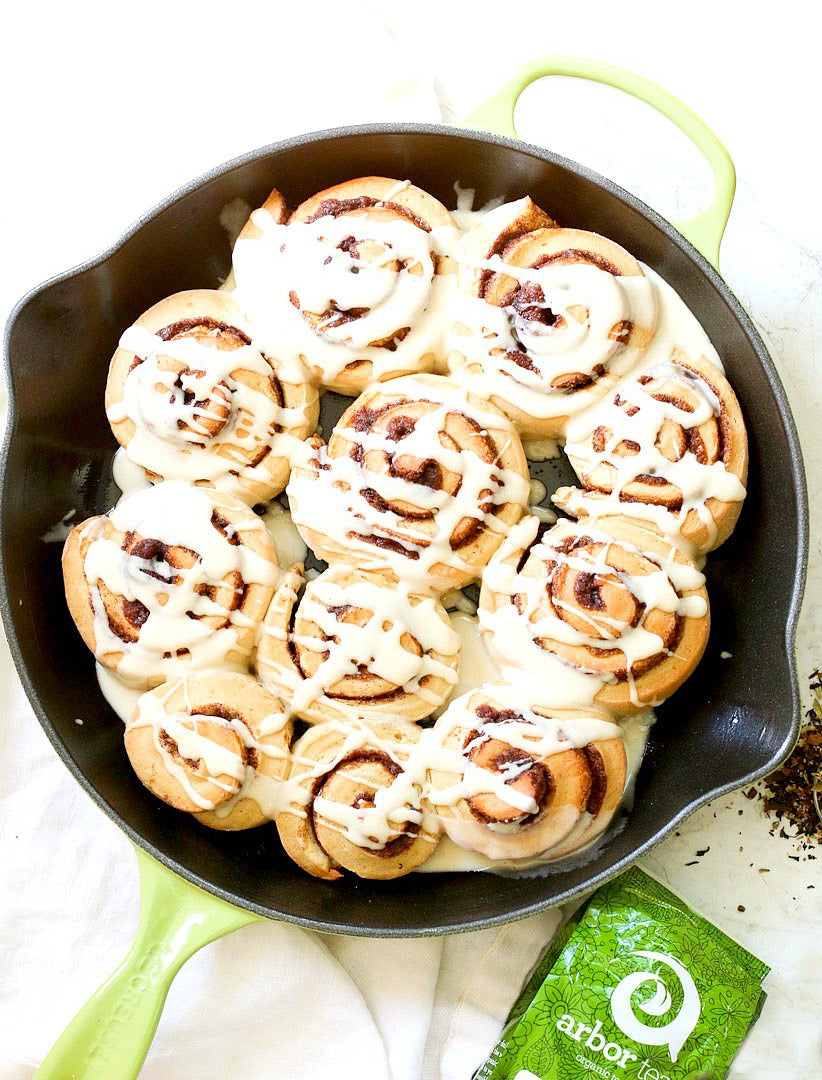 Skillet of Cinnamon Rolls with drizzled glaze