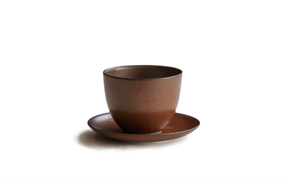 Brown ceramic cup and saucer