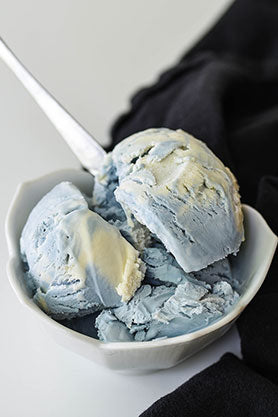 Scoops of Blue Moon Swirl Ice Cream in white bowl