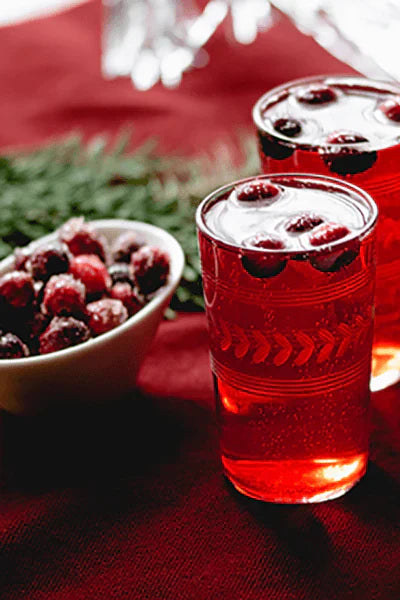 Two glasses of festive Cranberry Spice Sparkler drink