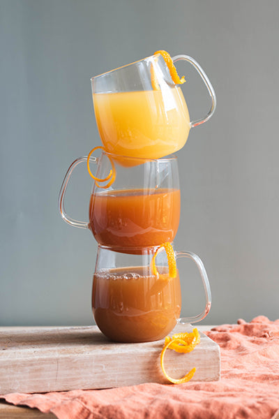 Three glasses artfully stacked filled with Earl Sunshine drink 