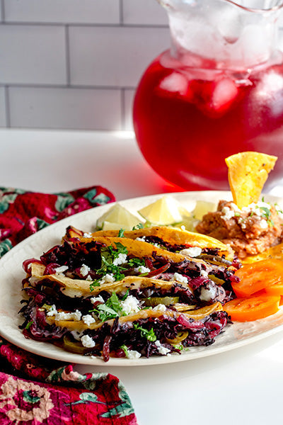 Plate of hibiscus Quesadilla with pitcher of Iced Hibiscus Tea