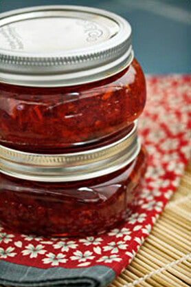 Two canning jars filled with Holiday Spice-y Red Pepper Relish