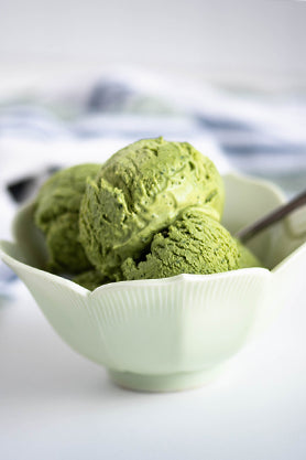 Scoop of green Matcha Ice Cream in white bowl