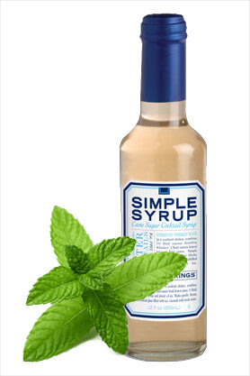 Bottle of Minty Simple Syrup with mint leaf