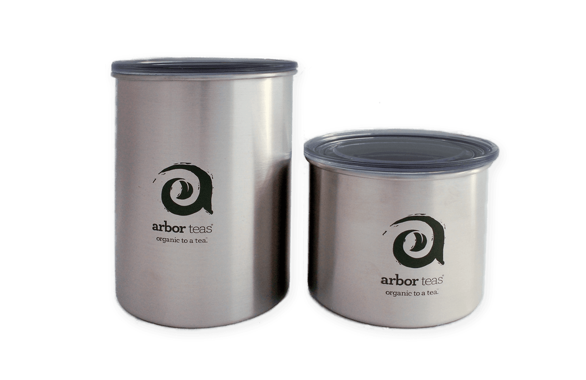 Two stainless steel containers with 'arbor teas' logo 