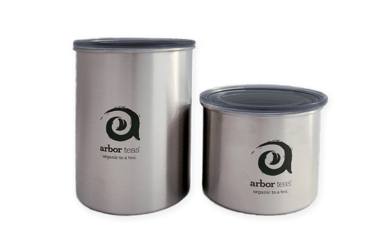 Two stainless steel containers with 'arbor teas' logo 