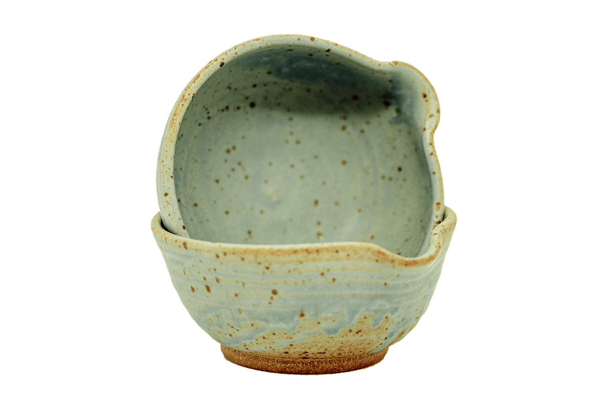 Stacked ceramic matcha bowls with pouring spouts