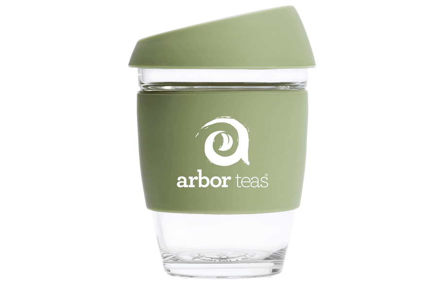 Green reusable coffee cup with 'arbor teas' logo