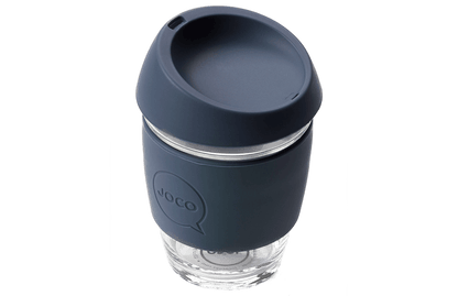 Reusable glass coffee cup with a dark blue lid 