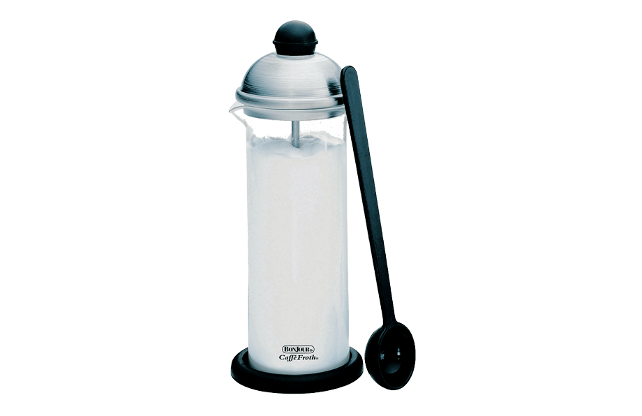 French press style milk frother with a black spoon