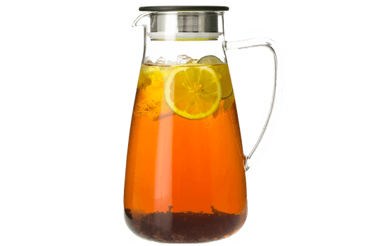 Glass pitcher filled with iced tea and lemon slices