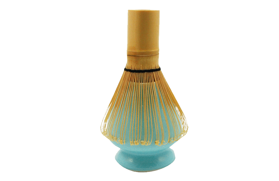 Bamboo whisk on a turquoise ceramic matcha stand