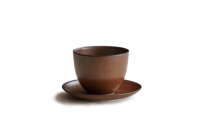 Brown ceramic cup and saucer 