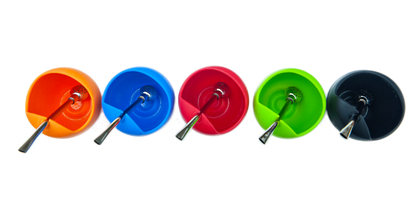 Overhead view of five colorful silicon gourds with metal bombillas