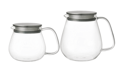 Two clear glass teapots with metal mesh lids