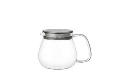 Clear glass teapot with a metal mesh lid 