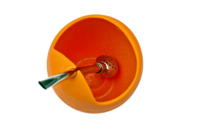 Orange silicone tea gourd with a metal tea straw